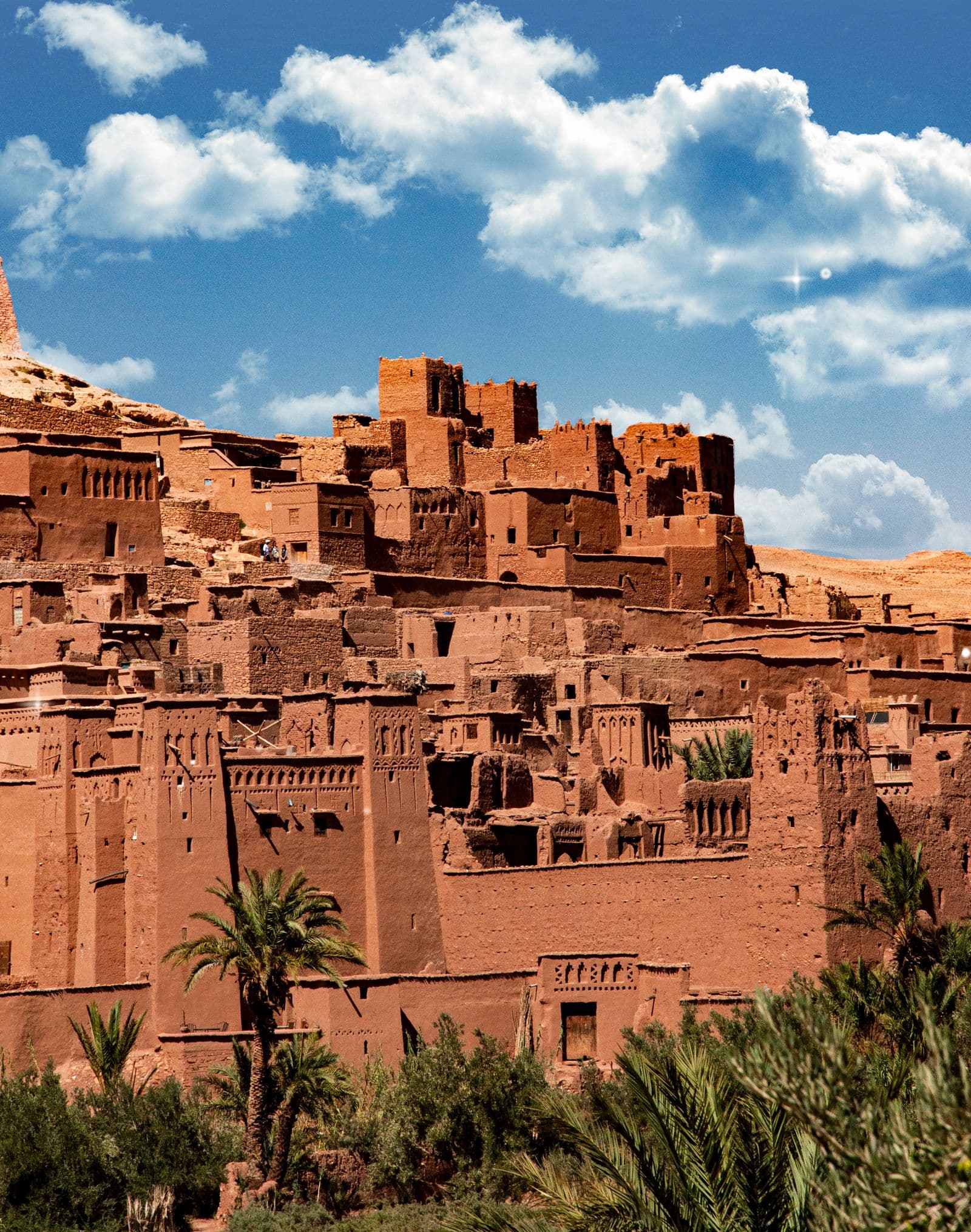 The fortified earthen ksar of Ait Ben Haddou rising in tiers above the palm groves